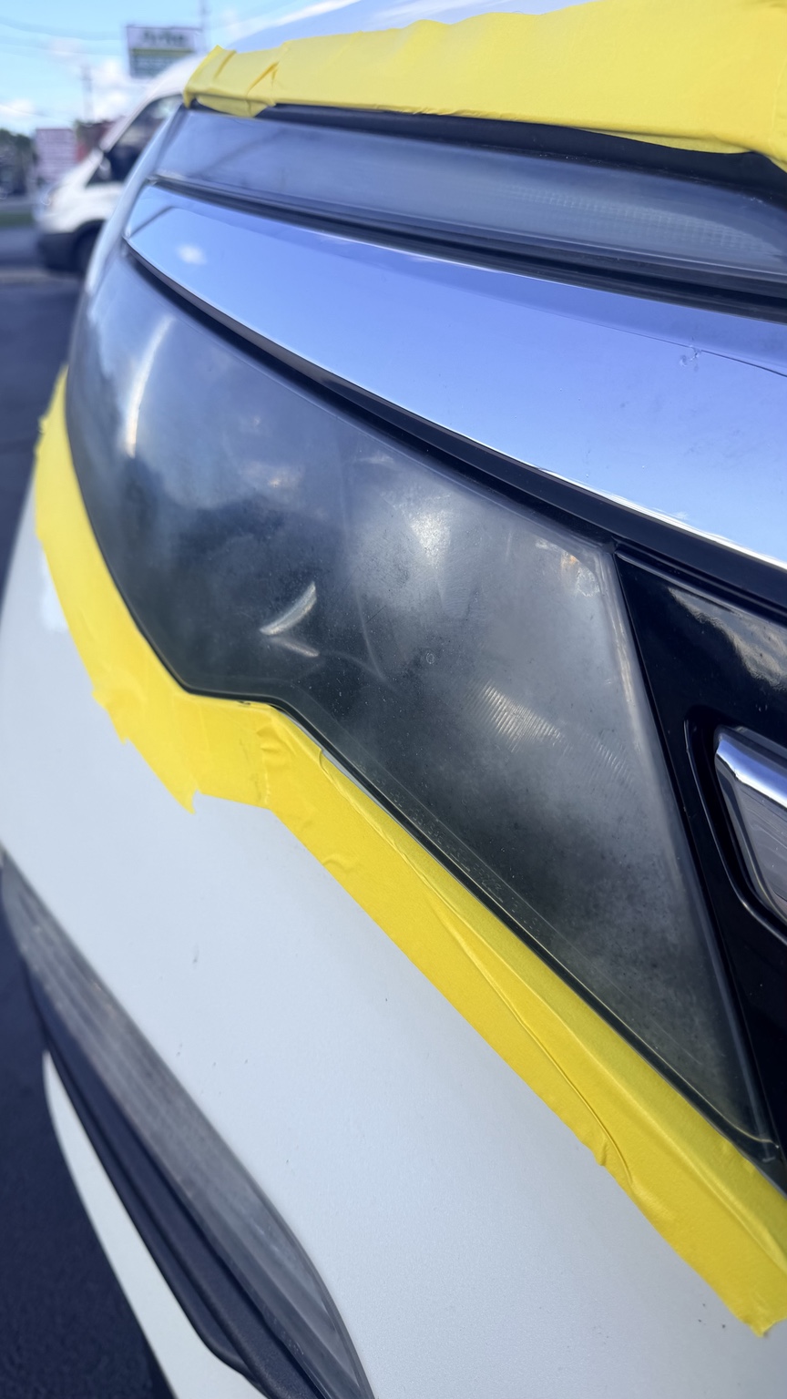 Before headlight restoration showing cloudy, hazy lens